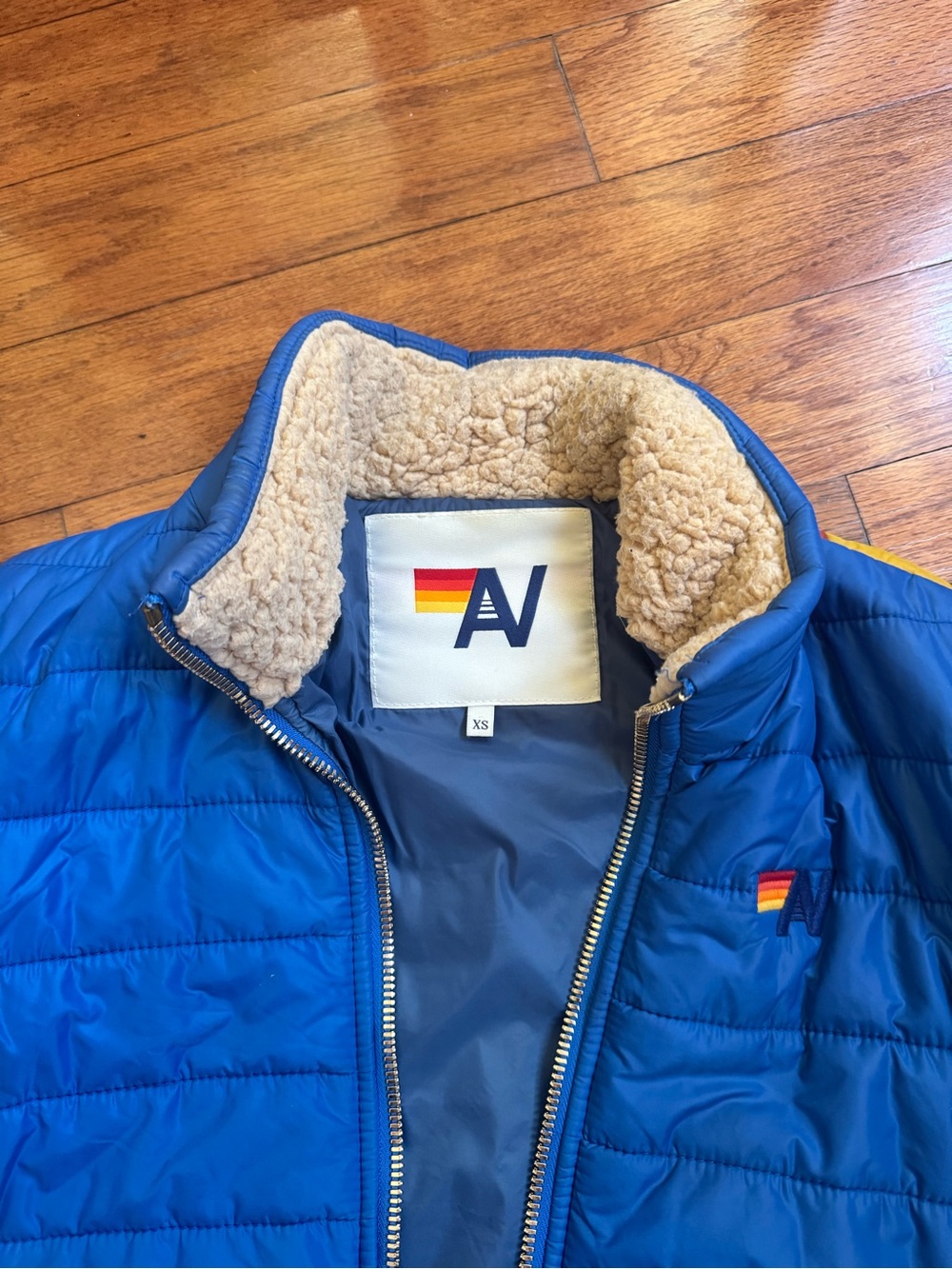 Aviator Nation Blue Puffer Jacket with Rainbow Sunburst - Picture 3 of 4